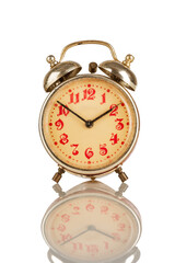 Old Analog alarm clock on a white background...