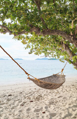 Hammock on the beach of a tropical island, Philippines.