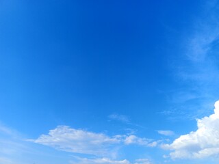 Expansive Blue Sky with Fluffy Cumulus Clouds