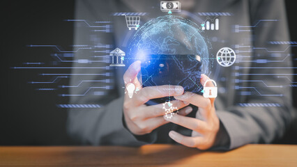 Businessperson holding smartphone with digital globe hologram and fintech icons, symbolizing global finance, cybersecurity, and innovation. Financial and banking, Digital link tech, big data.