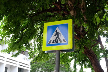 The pedestrian crossing, also known as a zebra crossing sign in Thailand, with blue and white colors