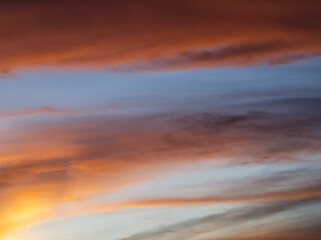 Golden twilight sky with faint cloud streaks.Color-splashed at sunset with warm hues. 
