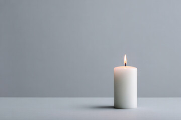 minimalistic composition featuring ultrabright candle on clean light gray background