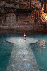 Tourist enjoying a healing ritual in a cenote Suytun in magic town, yucatan, mexico