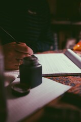 man practicing calligraphy 