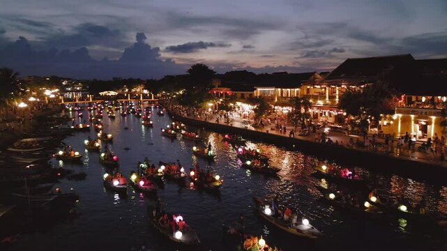 Twilight Drone Shot of Lantern Boats and Riverside in Hoi An Vietnam