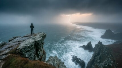 Solitary Figure on a Rocky Cliff Overlooking a Stormy Ocean with Lightning Strike