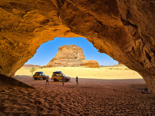 Cars near a cave in Ennedi Chad Africa 