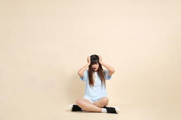 Fototapeta premium 20s Asian Woman in Light Blue Shirt and White Shorts