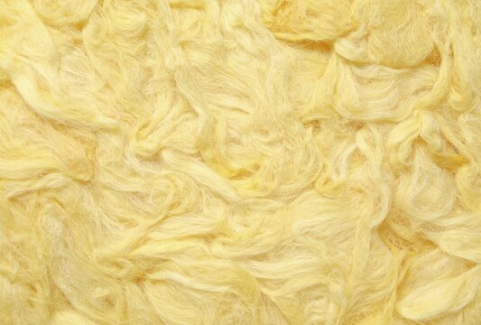 yellow fiberglass insulation batts texture rockwool closeup background