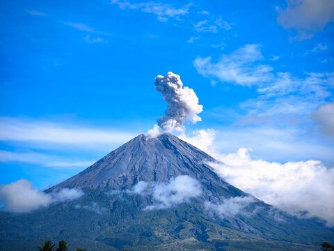 Scenic View of Mount Semeru with Rising Smoke in morning. 
