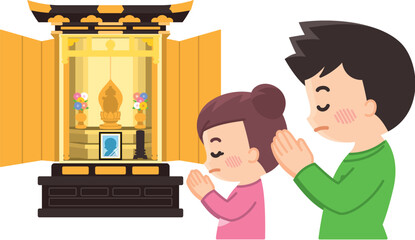 仏壇に向かって合掌する親子