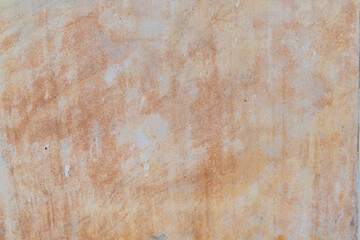 Textured abstract orange and beige grunge wall surface background