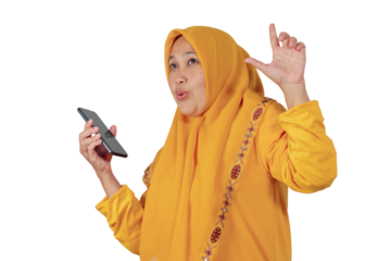 Expressive Southeast Asian woman in yellow hijab holding smartphone while gesturing and speaking passionately, showing emotion and communication, isolated on white background