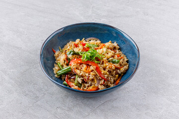 Colorful Stir-Fried Vegetable Rice Bowl with Crispy Sesame Garnish Layers