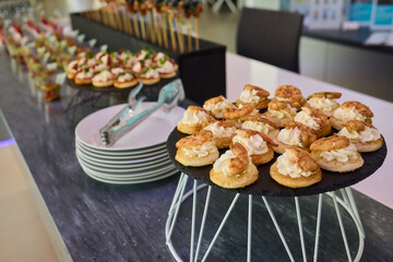 An Elegant Assortment of Gourmet Desserts and Savory Snacks Beautifully Arranged on Table