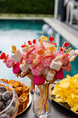 Outdoor catering buffet with a variety of food snacks and appetizers