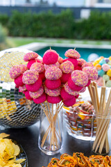 Outdoor catering buffet with a variety of food snacks and appetizers