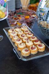 Outdoor catering buffet with a variety of food snacks and appetizers