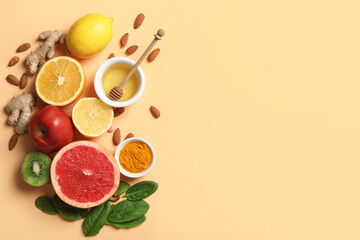 Composition with different healthy food and turmeric powder on color background. Immunity boosting concept