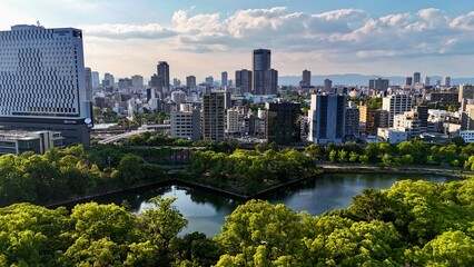 Naklejka premium Aerial view of Osaka city skyline at sunset, Japan