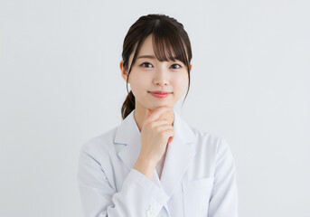 Portrait of a young female scientist wearing a white lab coat