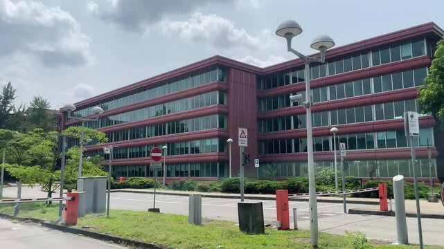 An eye-level shot of a modern, multistory building, a testament to the synergy of design, functionality, and urban life.