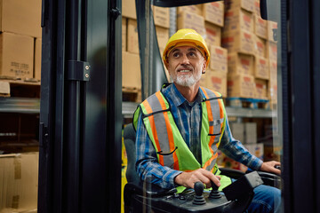 Senior forklift operator working in storage compartment of distribution warehouse.
