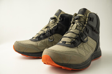 Mountain climber mid-cut hiking boots, isolated on white background.