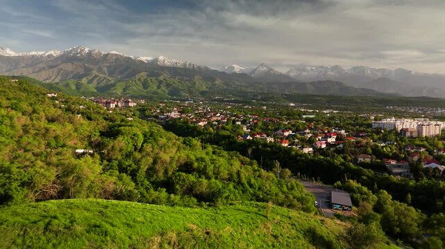 Aerial view panorama of houses and mountains in Almaty