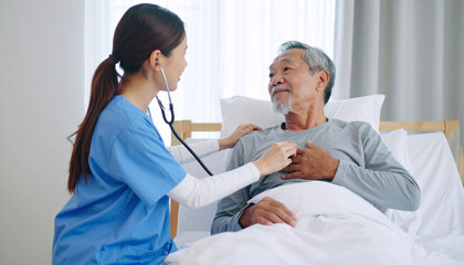 Obraz premium Senior Man and Nurse Using Stethoscope for Heartbeat Assessment – Elderly Health Check and Cardiovascular Care in Medical Setting