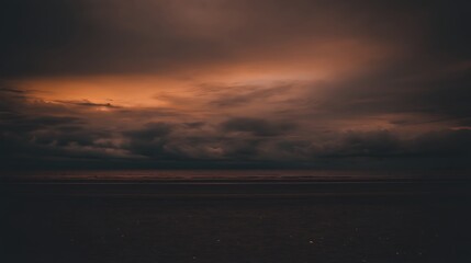 Fototapeta premium Dramatic sunset sky over the ocean