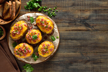 Baked stuffed potatoes with bacon, green onion and cheddar cheese