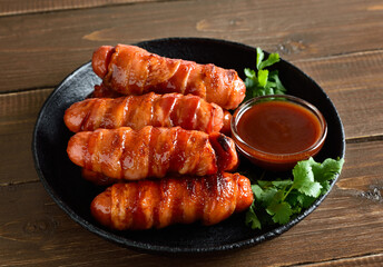 Bacon wrapped sausages