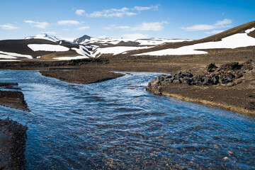 Wild icelandic snow covered highland in summer