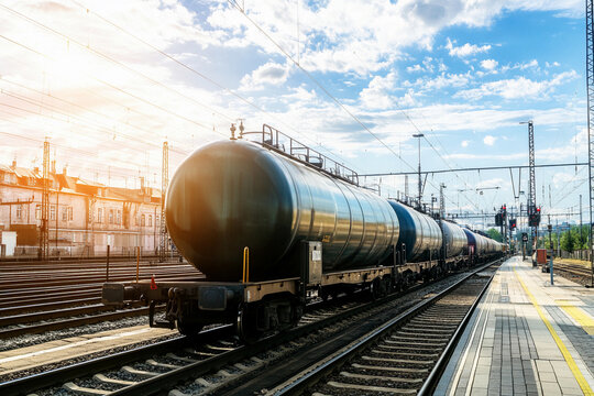 Fototapeta Railway tank wagon on tracks under sunny sky Generative AI