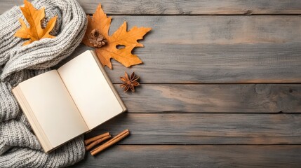 autumn on scene book concept. Cozy autumn scene with a blank book and fallen leaves on wooden surface.