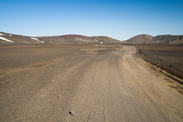 Lonely gravel road in the icelandic highland