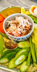 Chilli dip in Thai style food with various kinds of vegetables for dipping in Thai restaurant