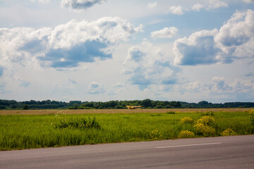 Yellow biplane on the field in Daugavpils, Latvia
