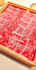 Japanese beef, wagyu, in thin sliced serves for shabu shabu, Japanese style hot pot, in luxury premium expensive restaurant