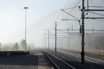 Railway line dissapearing into the fog