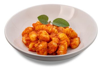 Gnocchi topped with tomato sauce and melted cheese with sage foliage, Dumplings in white plate isolated