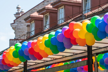 Rainbow colored balloons on a truck during a LGBT+ pride parade