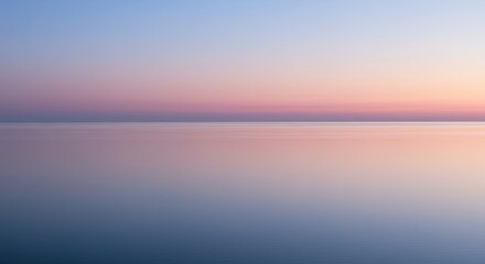 Serene and tranquil seascape with a gradient sky reflecting on the calm water surface