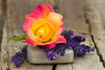 bar of natural soap, lavender flowers and rose