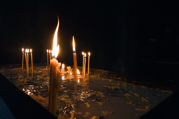 Burning candles in the Armenian monastery at night