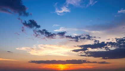 Colorful Sunset Sky with Clouds Over Horizon at Dusk