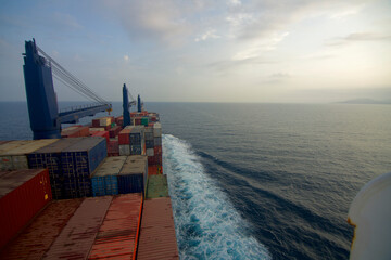 Container ship underway at sea in the morning
