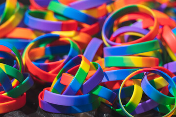 Pile of rainbow coloured rubber bracelets symbol of LGBTQ culture